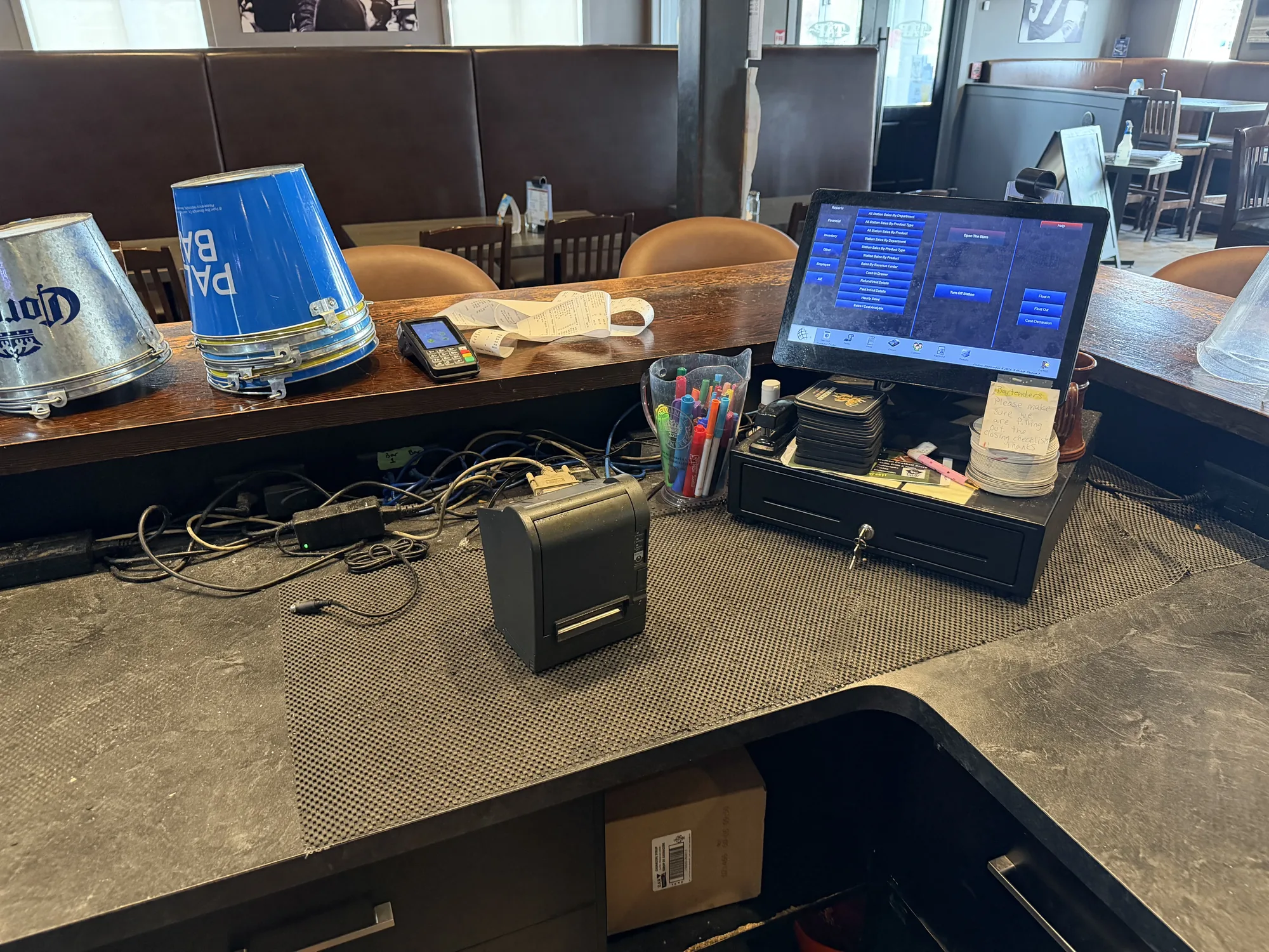 POS counter before cleanup, with loose equipment and cabling